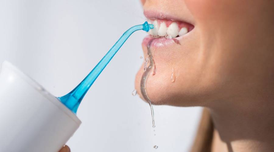 Water flosser for improving gum health and oral hygiene