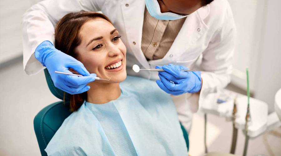 A dentist performing a dental procedure with precision, highlighting the importance of hand skills in dentistry.