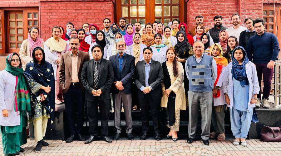 Group photo of PDA Lahore team, instructors, and workshop participants at de’Montmorency College of Dentistry.